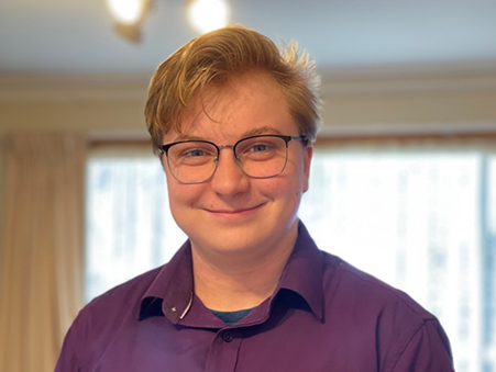 Portrait of a smiling Elliot Nicholas